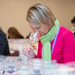 workshop person in pink tasting